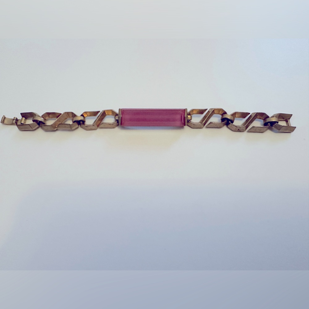 Sam Edelman gold colored chain bracelet with bright pink stone